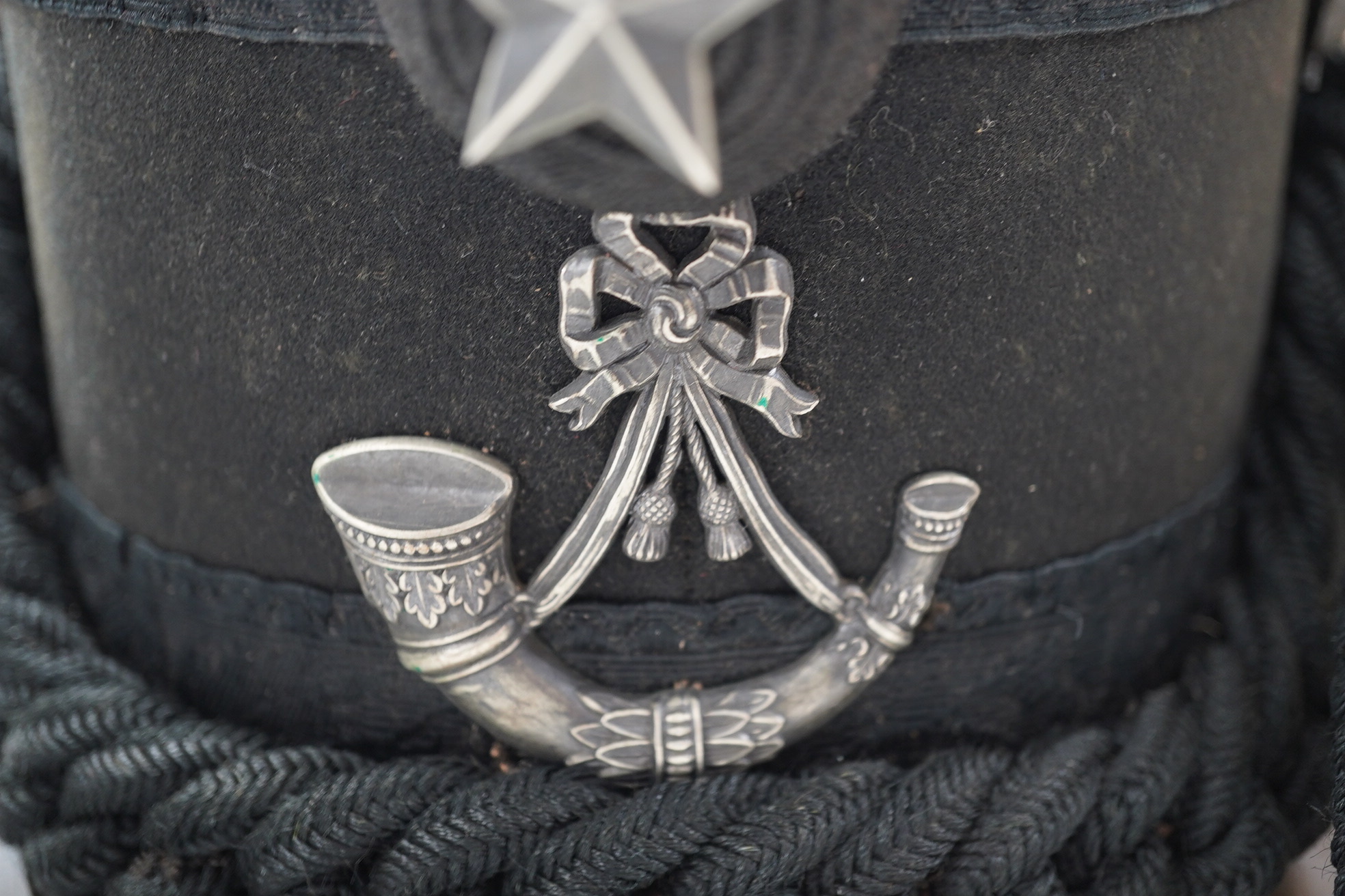 A Victorian tin cased Scottish Rifles officer's shako by Cater & Co. Pall Mall, London, with cap badge for the Cameronians, Applied plaque to lid engraved R. Robertson Esq. 2nd Scottish Rifles. Condition - fair to good,